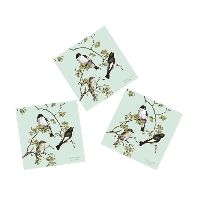 a phot of three packs of paper napkins featuring 3 birds on each 