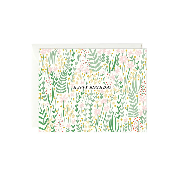 a greetting card covered in pretty illustrated green plants and soft coloured florals with text happy birthday 