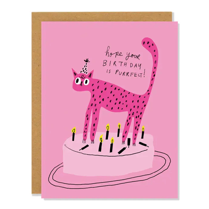 a greeting card with illustration of a black polka dtted pink cat astanding in a cake with text. hope your birthday is purrrfect 