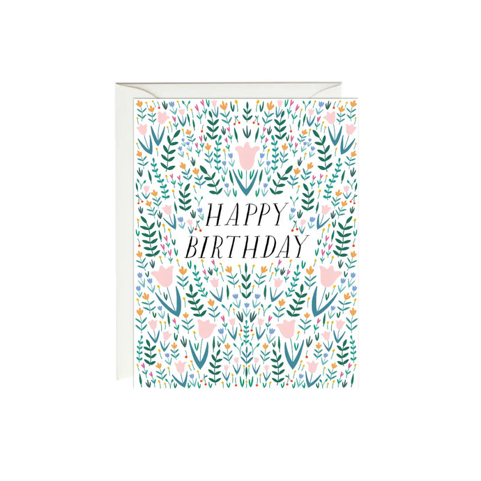 a white greeting card with green and pink illustrations of plants and tulips with text happy birthday 
