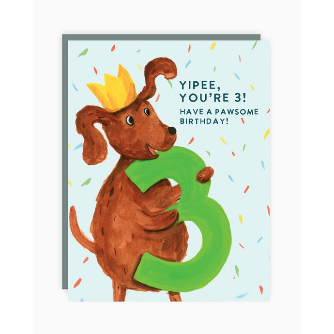 a greeting card with an illustration of a brown dog holding a big number three text yipee you're three have a pawsome birthday 