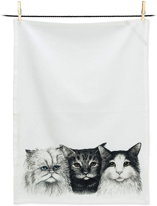 a white tea towel with three black and white cats heads as a motif 