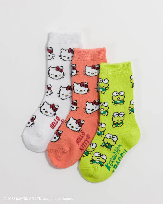 child sized socks set of three. one white with hello kitty motif, 2nd pink with hello kitty motif, 3rd green with keroppi frog motif 
