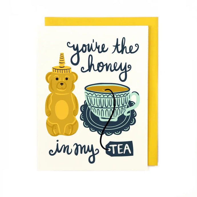a greeting card with illustration of a teddy bear honey bottle and a cup of tea. text. you're the honey in my tea