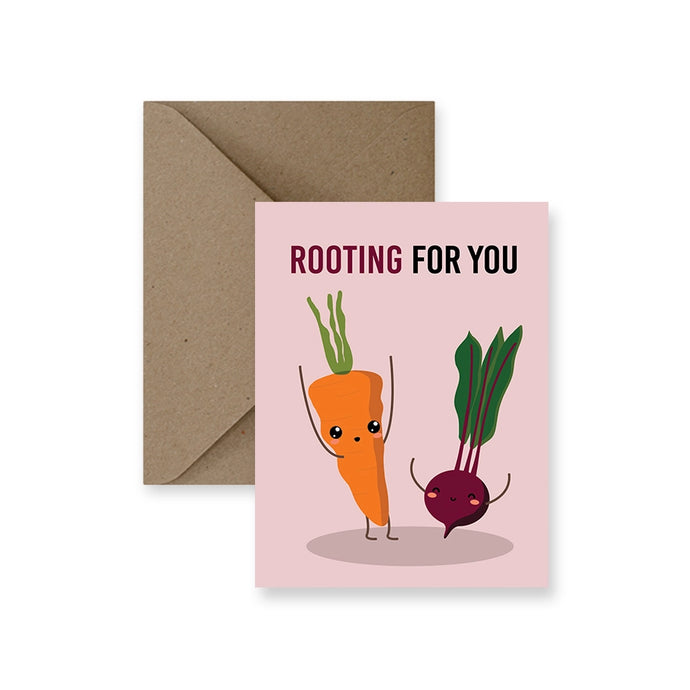 a photo of a greeting card with two vegetables one a carrot and one a beet whimsical, text rooting for you 