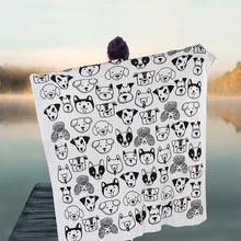 Load image into Gallery viewer, a person holding a blanket throw with black and white dog faces on it 
