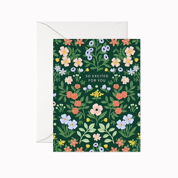 colour illustration of a greeting card covered in a meadow of flowers text so excited for you