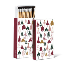 Load image into Gallery viewer, a colour phot of two boxes of matches. depicting assorted holiday trees as a motif 
