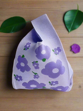 Load image into Gallery viewer, a mauve coloured floral motif on a knitted Japanese style knot bag purse
