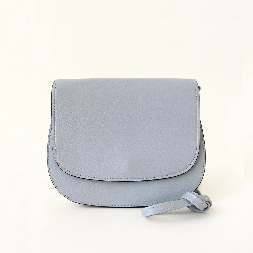 a small sky blue coloured handbag with strap