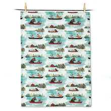 Load image into Gallery viewer, a kitchen tea towel with outdoor motif of animals in coanoes on a lake
