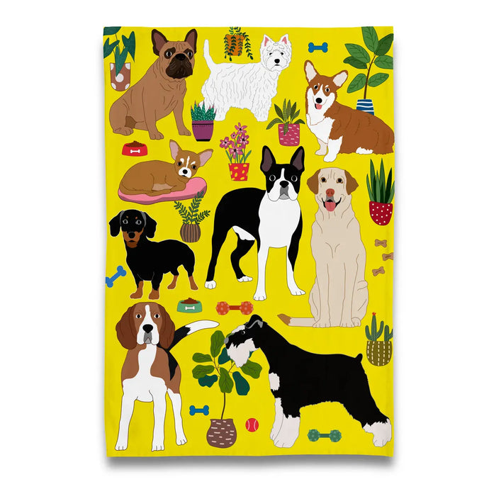 a tea towel covered in different dog breeds on a yellow backdrop. 