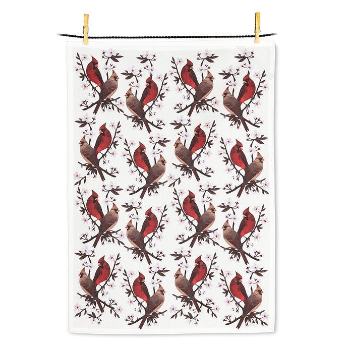 Tea towel with cardinal bird pattern hanging on a line