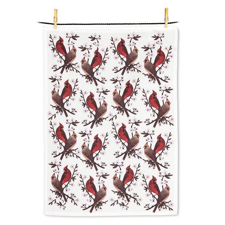 Tea towel with cardinal bird pattern hanging on a line