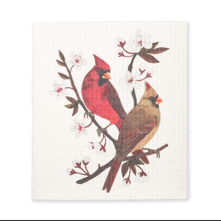 a Swedish dishcloth featuring 2 cardinal birds sitting on a cherry blossom branch