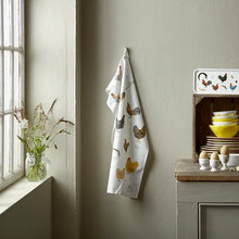 Load image into Gallery viewer, a tea towel with chicken on it hanging on a hallway peg
