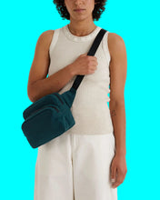 Load image into Gallery viewer, Person wearing a teal crossbody bag on a white background
