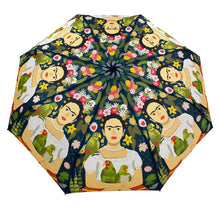 Load image into Gallery viewer, a colourful rain umbrella with images of Mexican artist Frida Kahlos parrots with the artist. 
