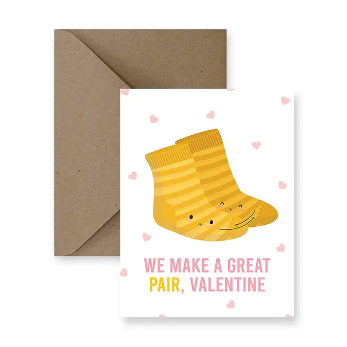 a greeting card with illustration of a pair of socks and small hearts. text. we make a great pair, valentine 