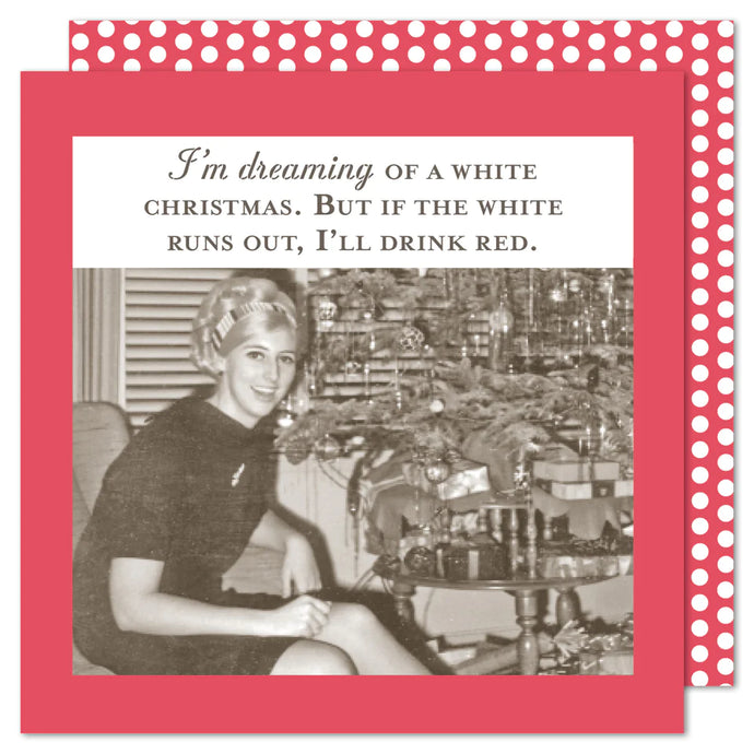 a beverage size napkin with a woman beside a Christmas tree . text. I'm dreaming of a white Christmas. But if the white runs out, I'll drink red. vintage style mid 50's to 60's 