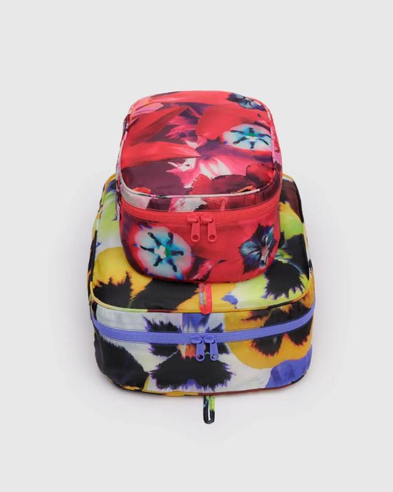 a set of 2 baggu brand packing cubes in a floral pansy motif 