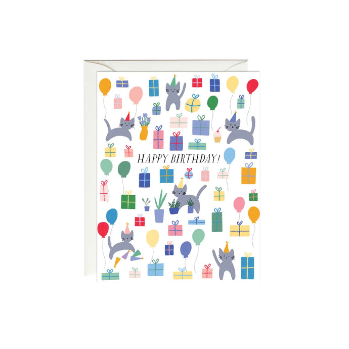 a white greeting card with whimsical illustrations of kitties and gifts and party balloons, with text happy birthday 