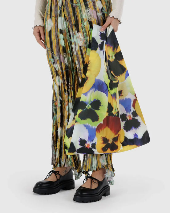 a baggu brand reusable bag in a photo floral pansy motif 