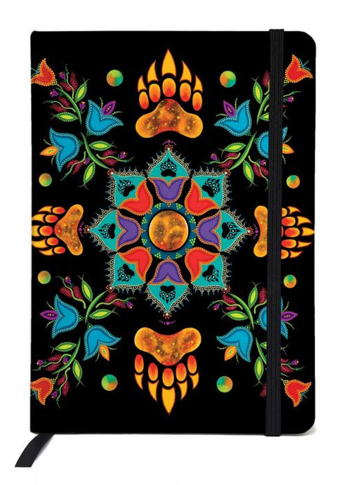 an Indigenous designed journal depicting animal claws and flowers 