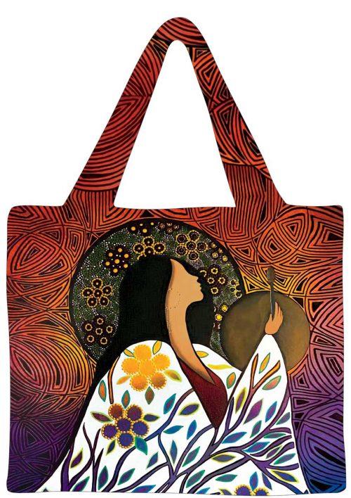 an Indigenous design tote bag depicting a woman wearing a robe looking up to the sky with a glow around her 