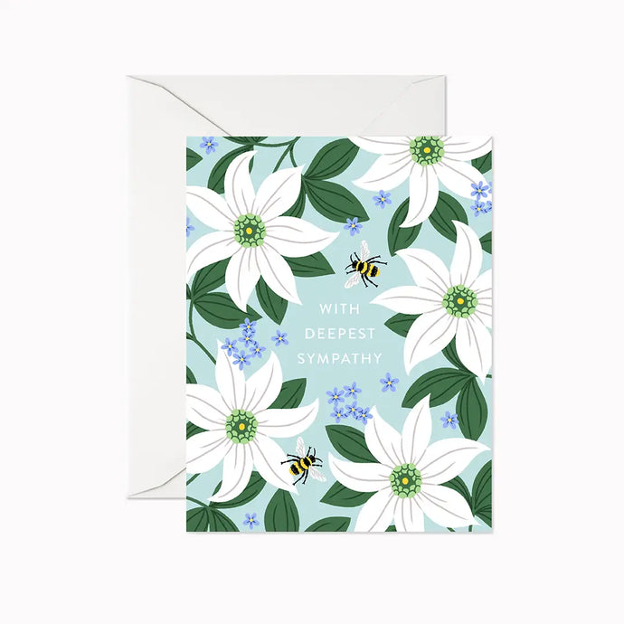 a greeeting card with white flowers and small bumble bees. text. with deepest sympathy 