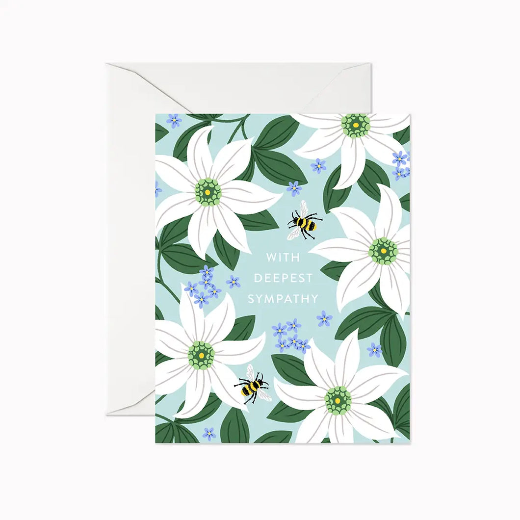 a greeeting card with white flowers and small bumble bees. text. with deepest sympathy 