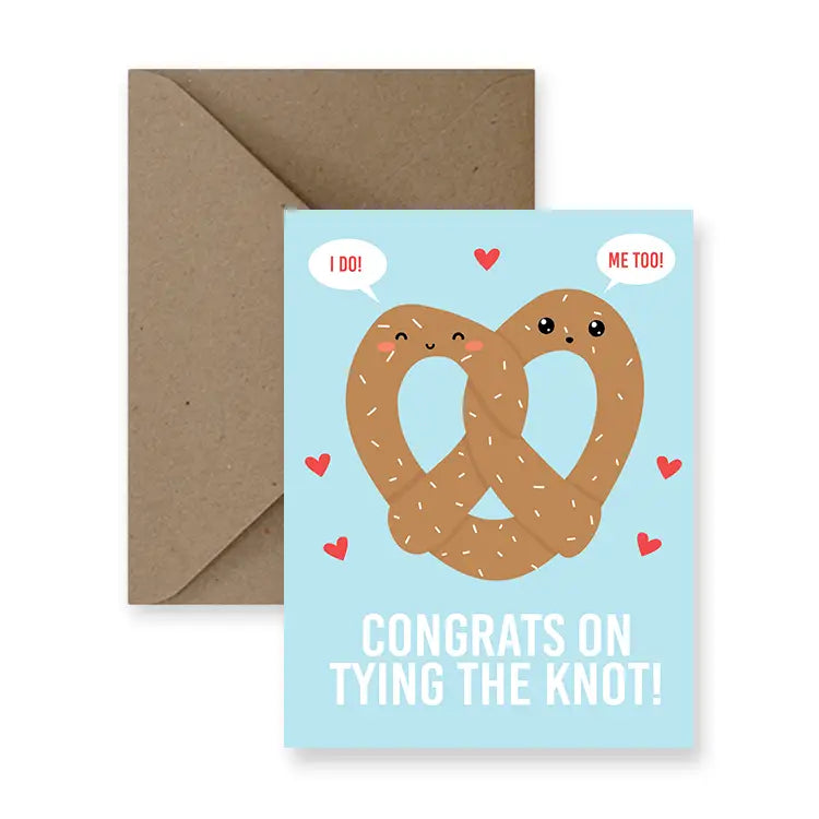 a greeting card with illustration of a big pretzel and little red hearts. text. congrats on tying the knot 
