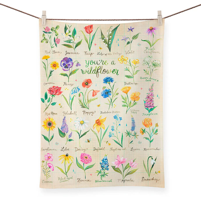 a colourful kitchen tea towel covered with assorted drawings of flowers and wild flowers. 