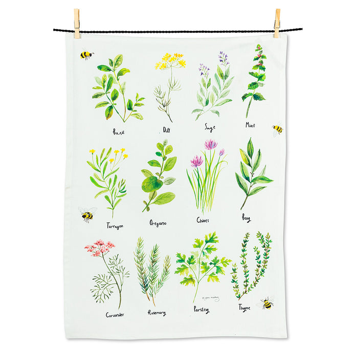 a white coloured tea towel with twelve different  illustrations of herbs, primarily in green with a few coloured accents, and bees sprinkled throughout 