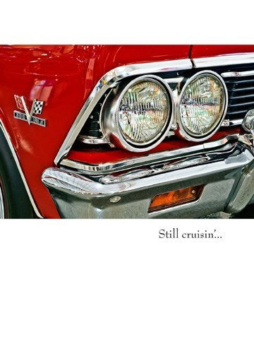 colour photo of a bright red chevy closeup of headlights 1960
