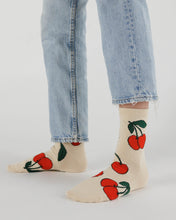 Load image into Gallery viewer, a person wearing the ecru cherry baggu bamboo socks 
