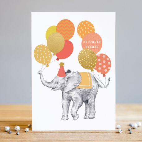 a white card with an illustration of a gray elephant in a ppeach coloured aprty hat with ballons tied to its trunk and tail, of peach, gold and orange colours 