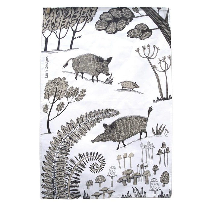 a tea towel with an artist depiction of wild boar mushrooms and ferns 