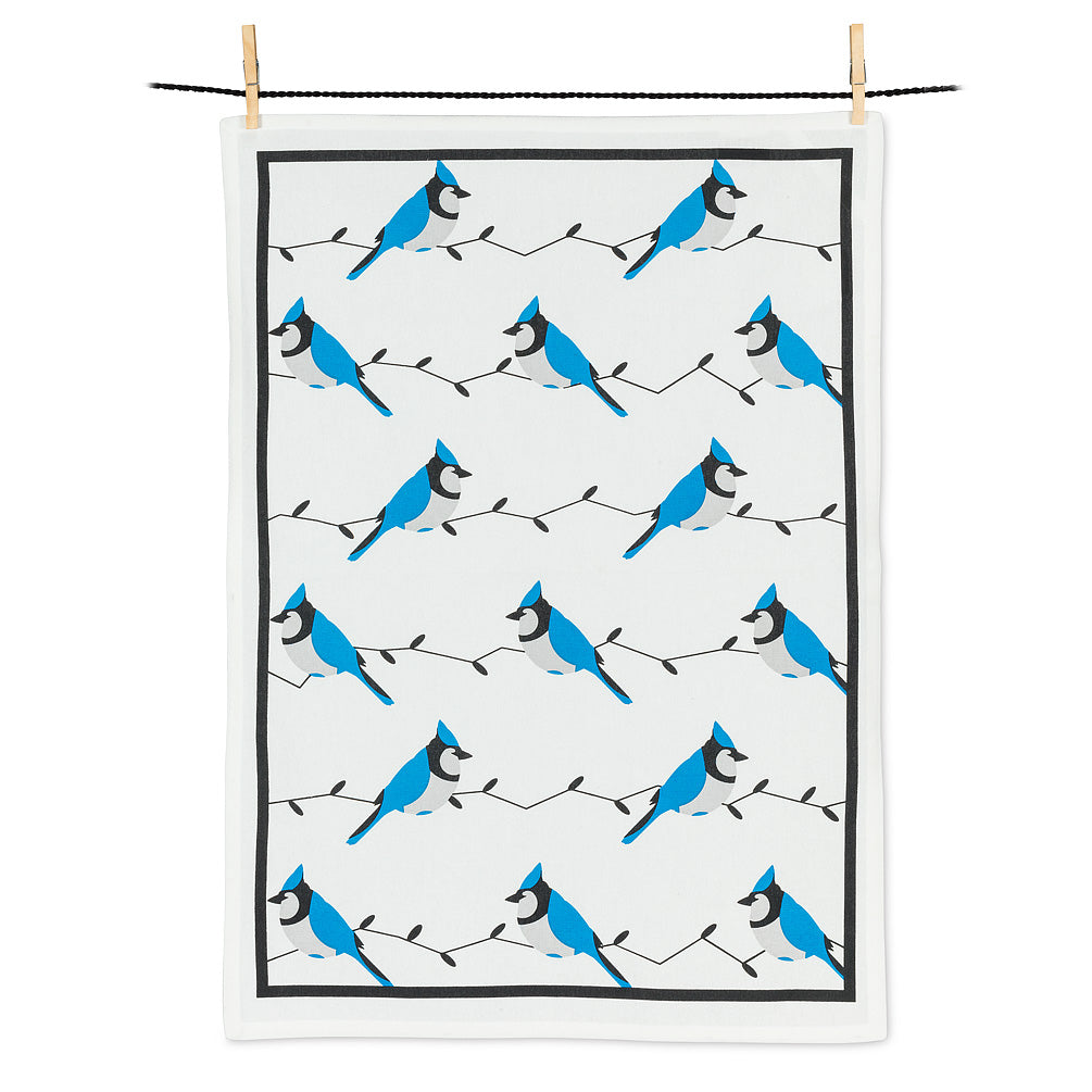 a phot of a tea towel kitchen towel covered in blue jay birds on a white background