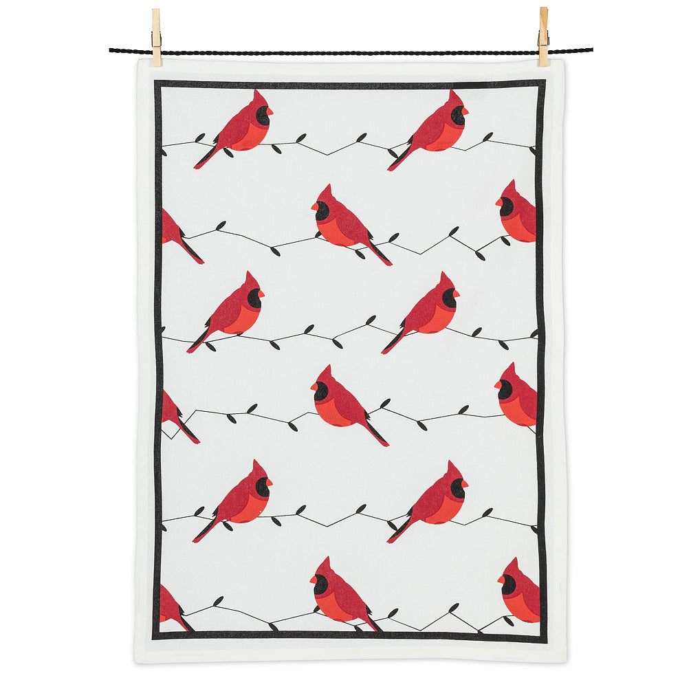 a white teal towel or kitchen towel with drawings of red cardinal birds all over 