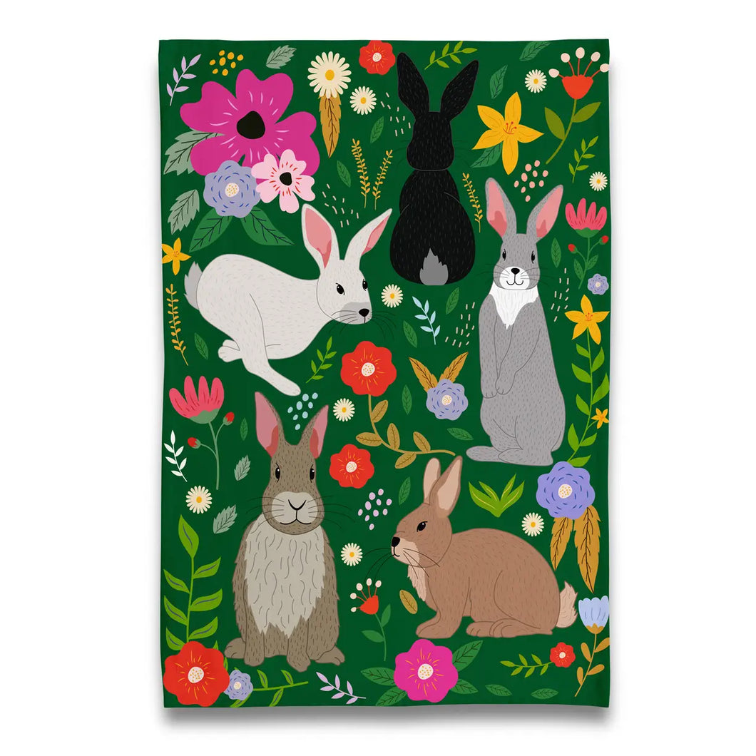 a kitchen tea towel with five different rabbits amongst flowers 