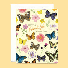 Load image into Gallery viewer, a colourful greeting card covered in different butterflies and small flowers with text have a beautiful birthday 
