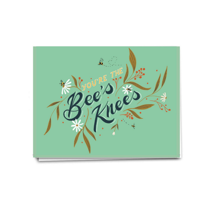 an illustration script says you're the bee's kness on green backdrop with little bees and white flowers 