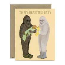 Load image into Gallery viewer, a greeting card depicting 2 sasquatch , one holding a baby sasquatch the other a baby toy. text to my besties baby 
