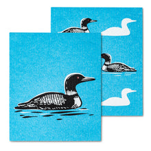 Load image into Gallery viewer, black and white loon on a blue backdrop as if swimming in the water

