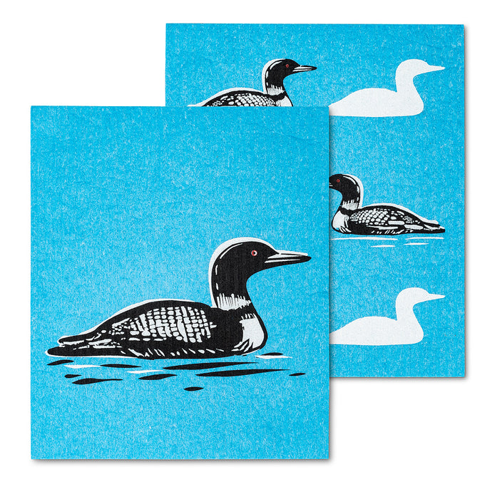 black and white loon on a blue backdrop as if swimming in the water