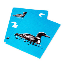 Load image into Gallery viewer, two swedish dishcloths with motif of loon birds on them on blue backdrop
