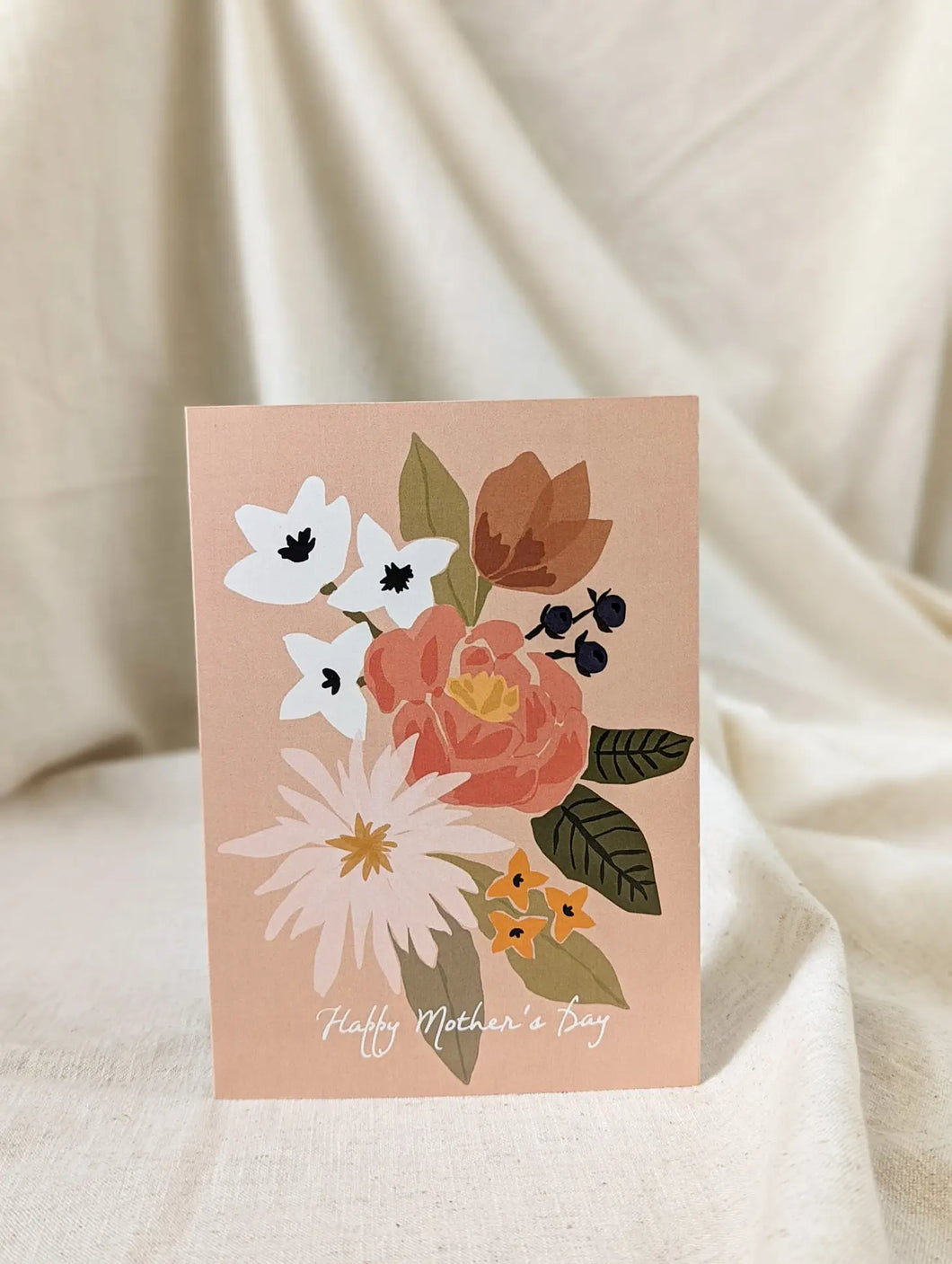 a photo of a greeting card with a peach colour and white and peach coloured flowers with text happy mother's day 