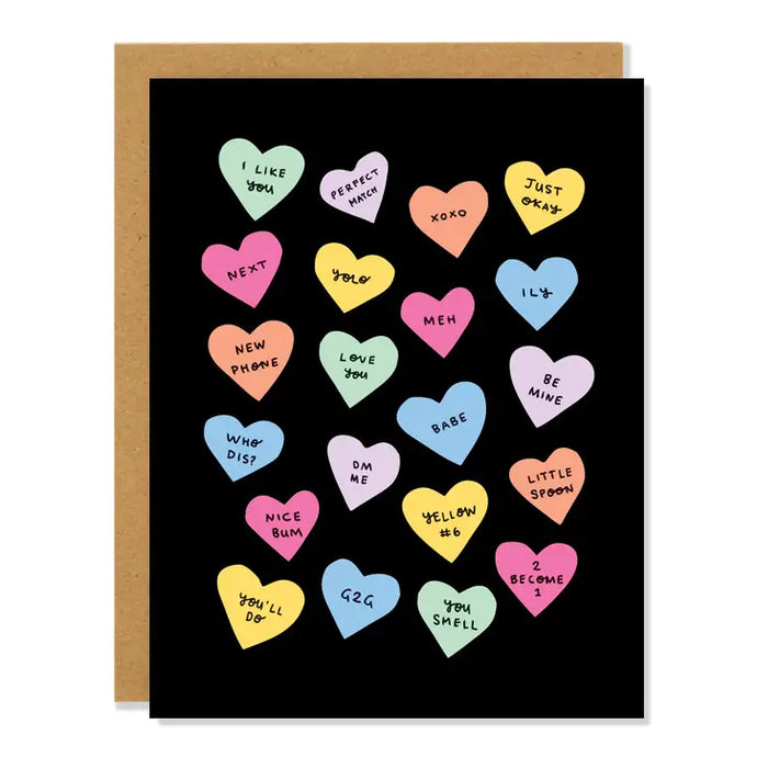 a black greeting card with several colourful candy hearts all over with sayings on each such as love you, babe, be mine you'll do, like vintage heart candy 