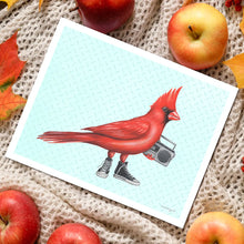 Load image into Gallery viewer, a greeting card depicting a red cardinal bird wearing hightop converse sneakers and carrying a music boom box 
